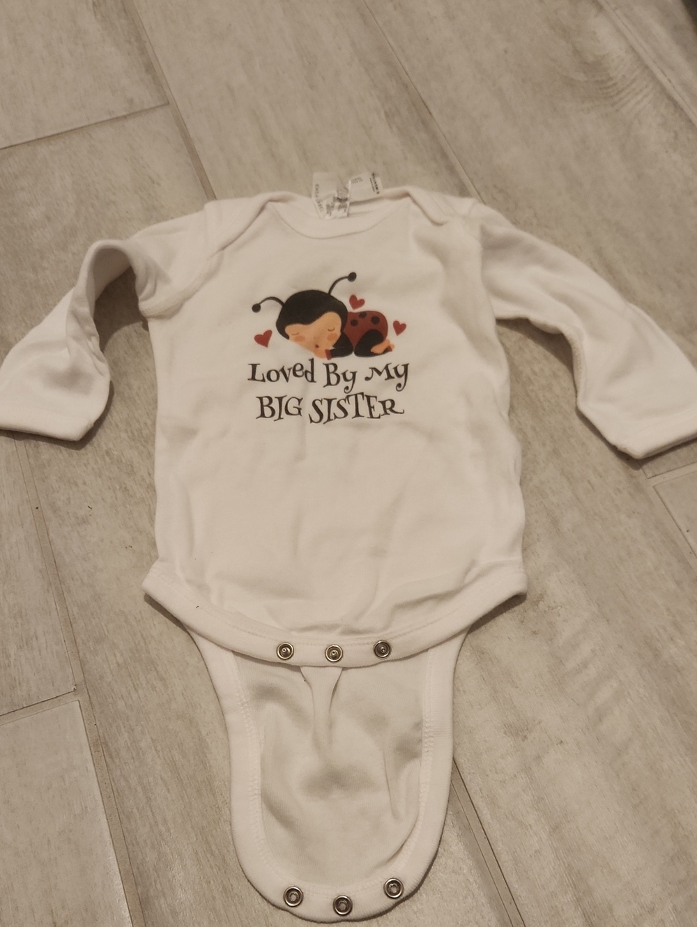 White 'Loved By My Big Sister' Long-Sleeve Baby One-Piece